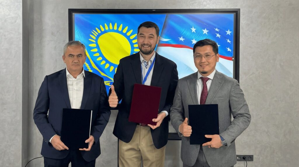 Askar Bilisbekov (QVG) and Dilshod Khashimov (UzVC) signing term sheet for Big Sky Capital investment